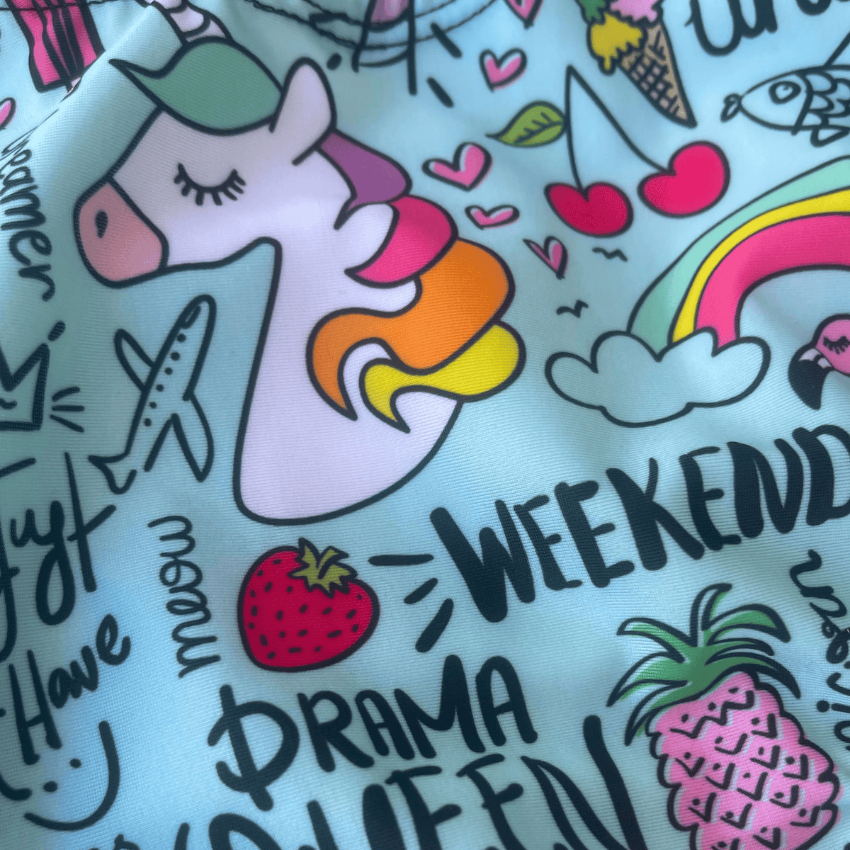 Kikx Extra Life Fastback Swimsuit in Unicorn and Summer Theme on Aqua Green