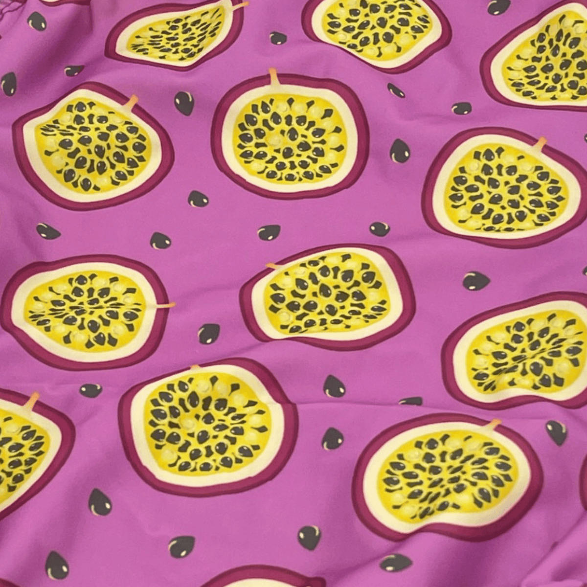 Kikx Extra Life Fastback Swimsuit in Passion Fruit on Light Purple Background
