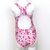 Kikx Extra Life Fastback Swimsuit in Full Print Flamingos in Splashes on White