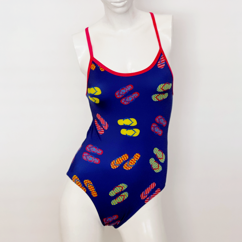 Kikx Extra Life Thin Strap Swimsuit in Slip Slops on Dark Blue with Bright Pink Straps