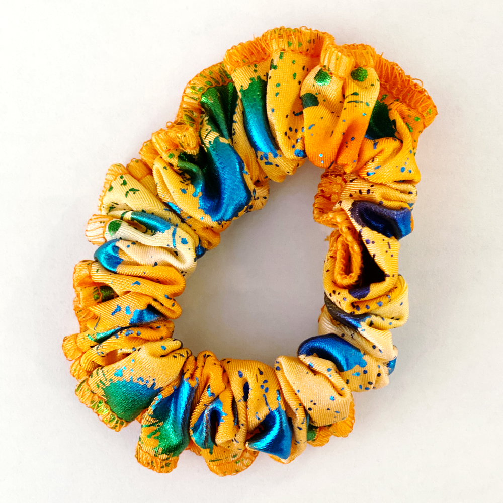 Kikx Gymnastics Hair Scrunchy in Orange with Blue and Green Foil